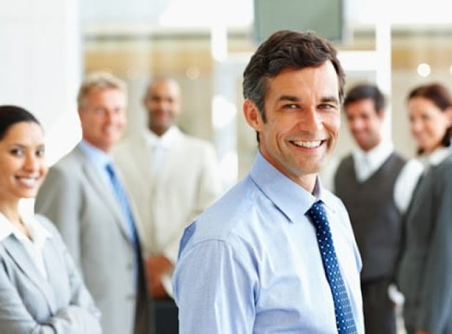 Smiling: Group of satisfied business people
