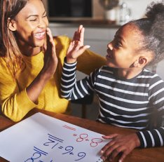 Learning to calculate, high five success, black mother and child