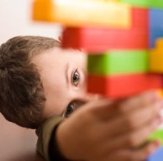 Canva - Cute kid playing with cubes