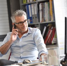 Businessman in office talking on phone