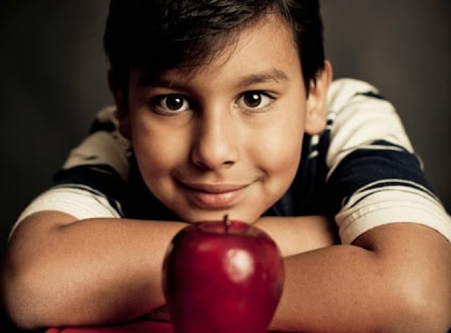 Young boy with apple